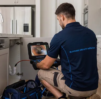 Clearing a blocked sink at a Palm Beach property
